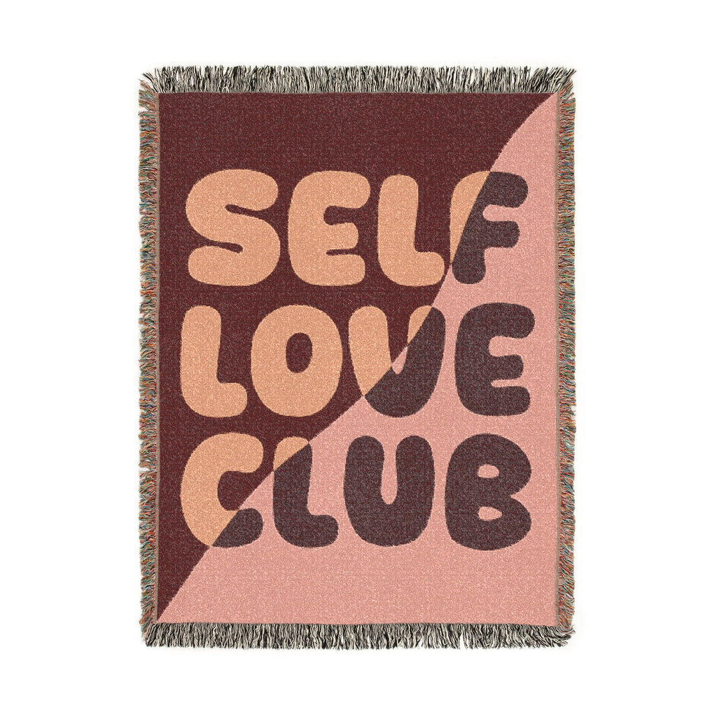 Woven blanket with "SELF LOVE CLUB" text design on a pink and brown background